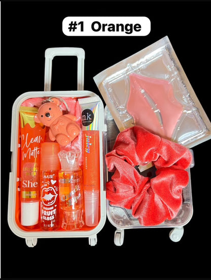 Mini Suitcase  Lip Glos Bundle ( lip oil, lip gloss, lip balm + scrunchie + random hydrating lip mask ).